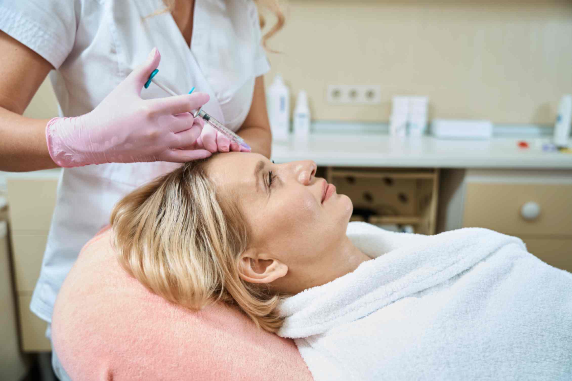 a women takes anti-wrinkle injection services