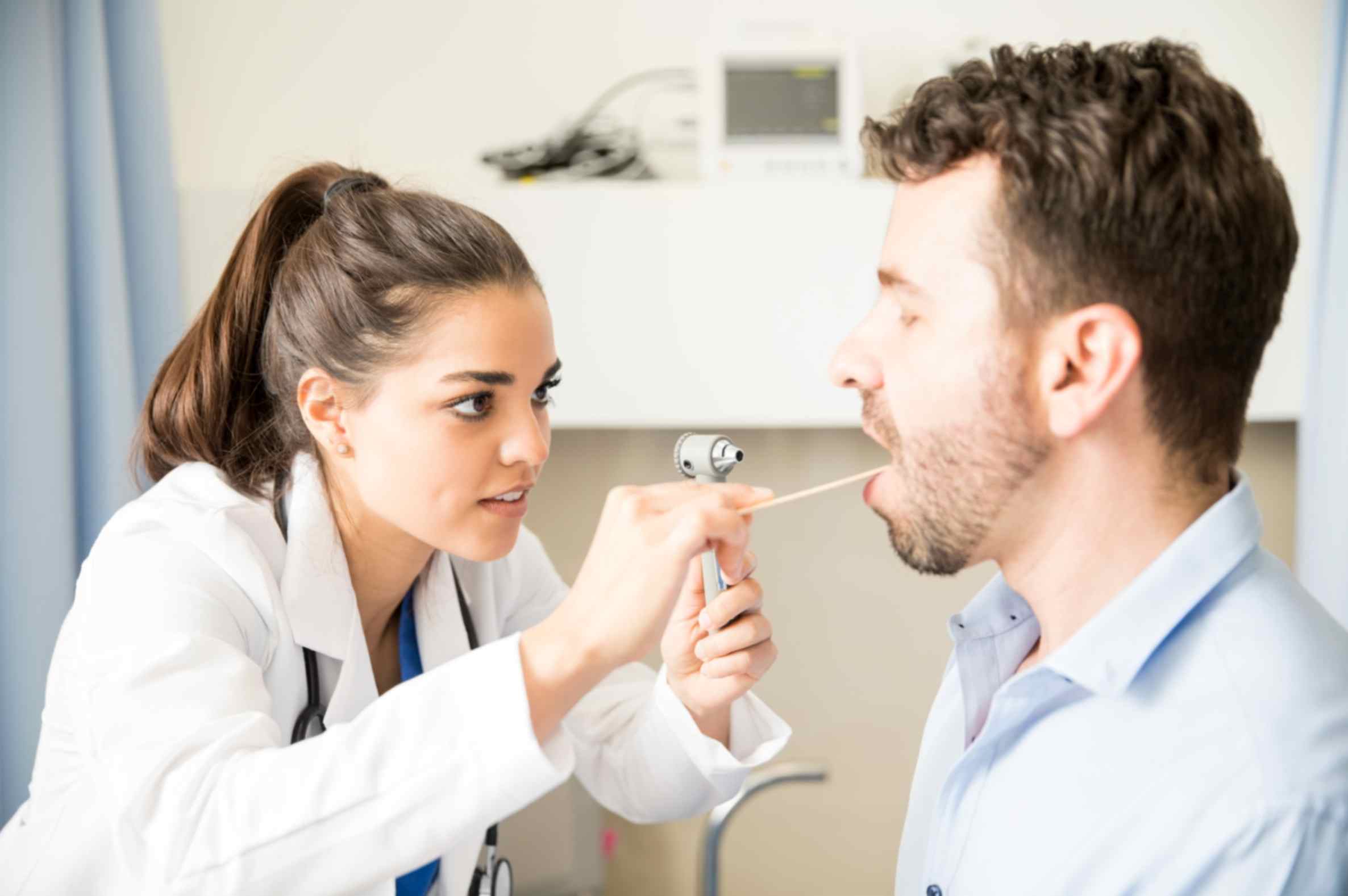 physician-examining-patient-with-otoscope-in-bebington-pharmacy
