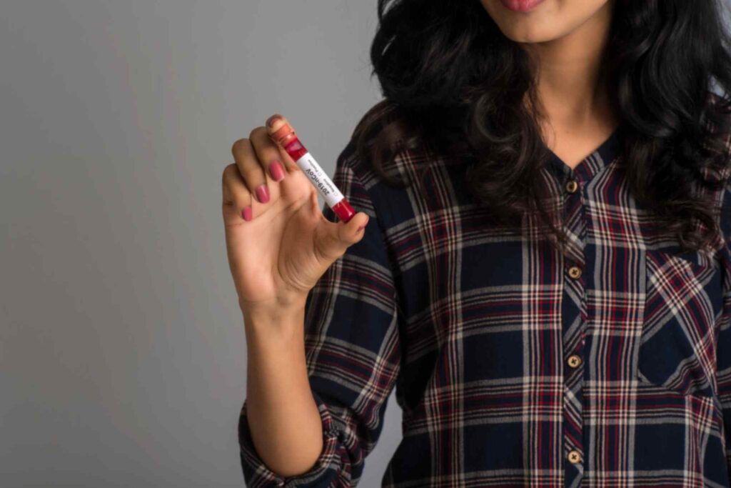 woman-holding-pregnancy-blood-sample-in-test-tube