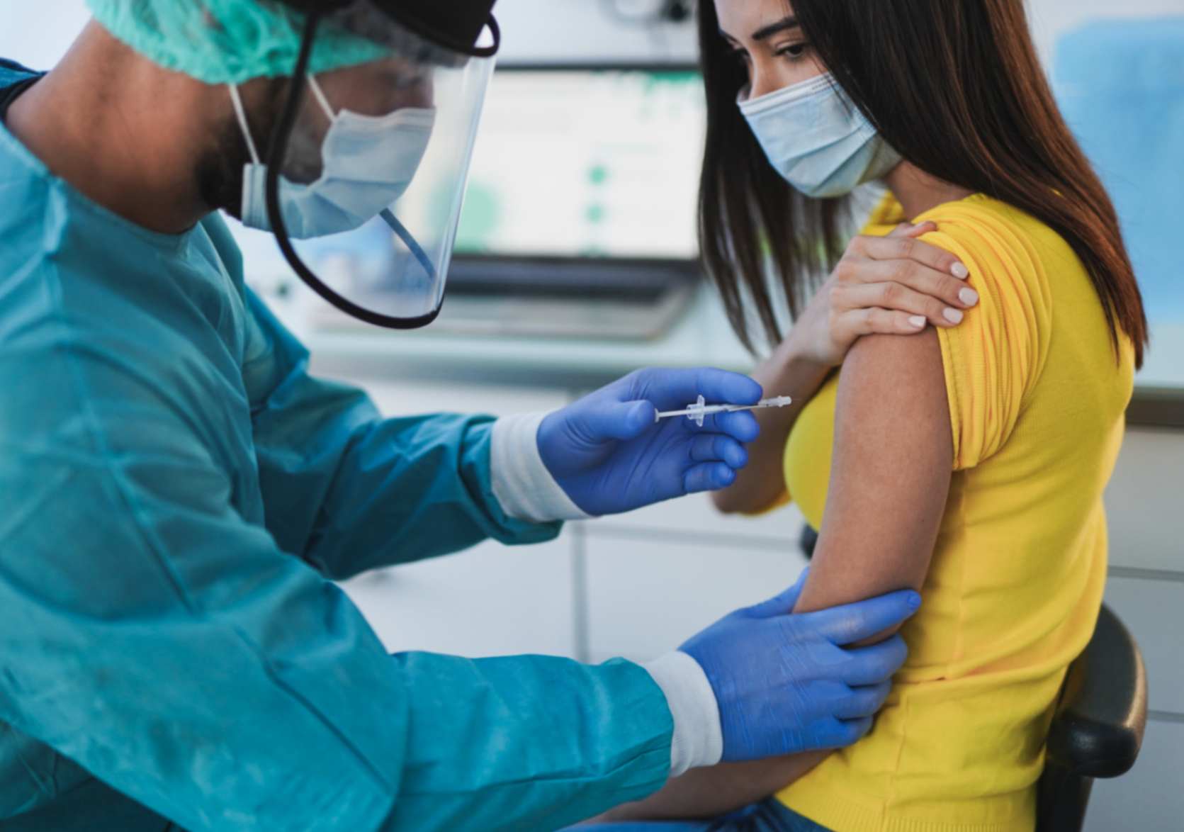 medical-professional-administers-typhoid-and-yellow-fever-injection-to-young-girl